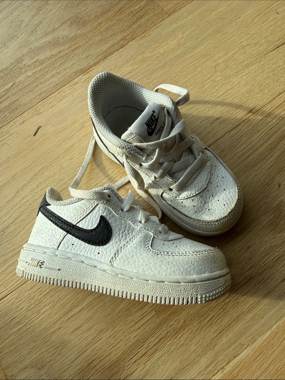 Nike Kids White Sneakers with Black Swoosh